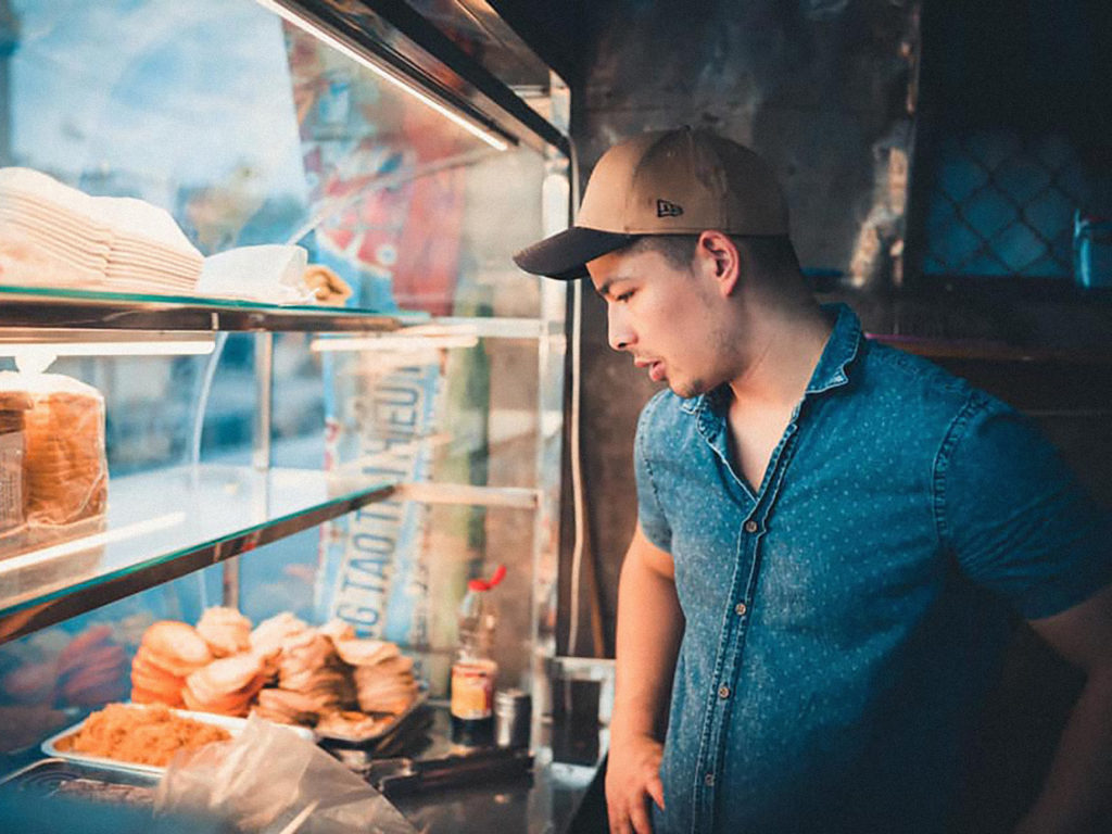 Nam at a street food stall in Vietnam